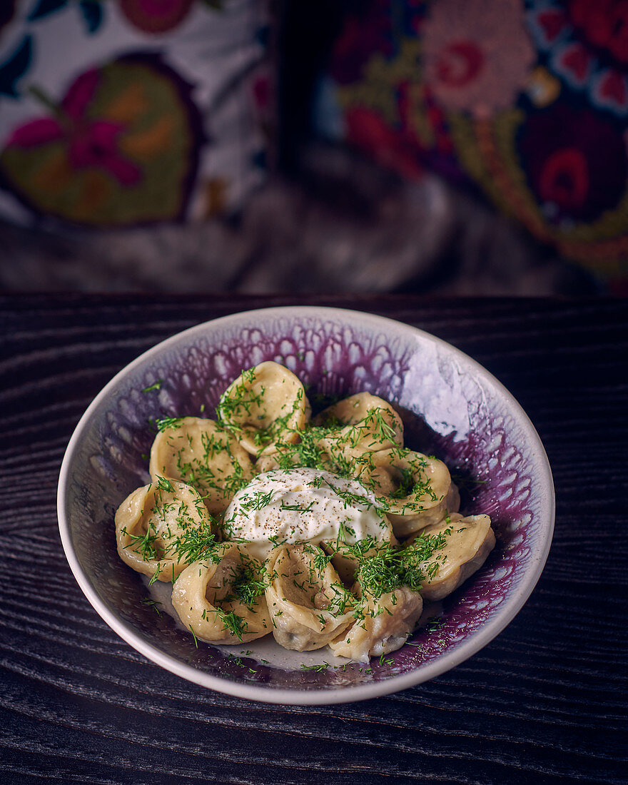 Pelmeni (stuffed dumplings, Russia) with a dip