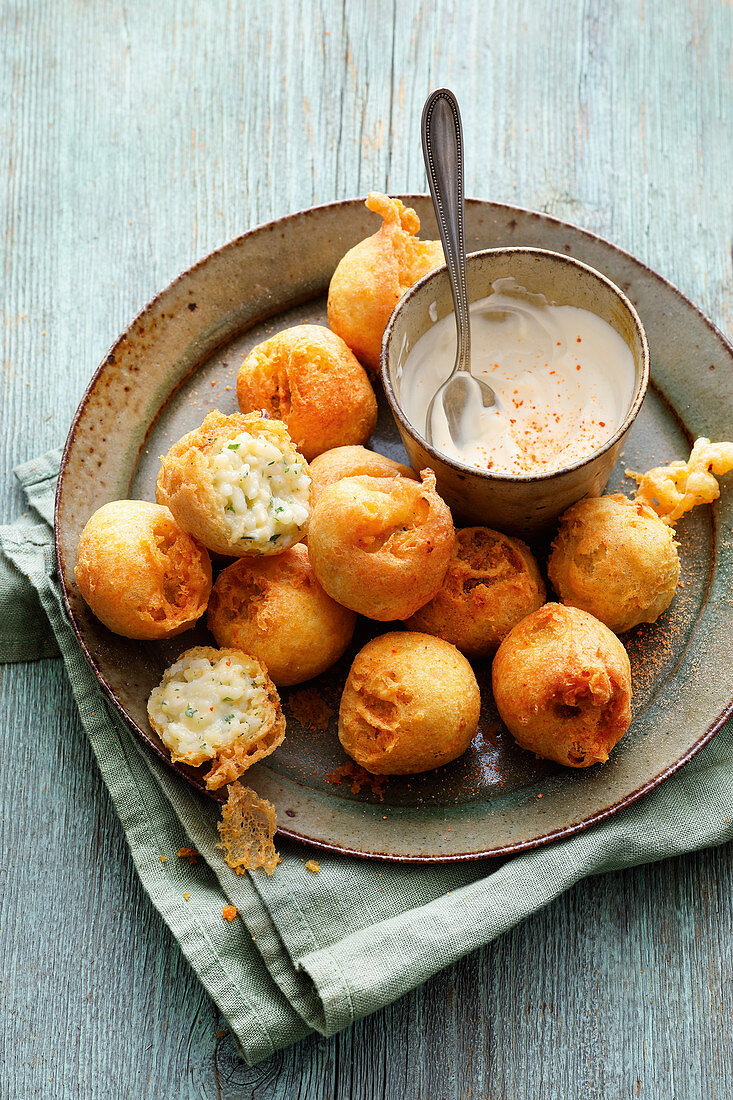 Sicilian Arancini: baked rice donuts with a yoghurt dip