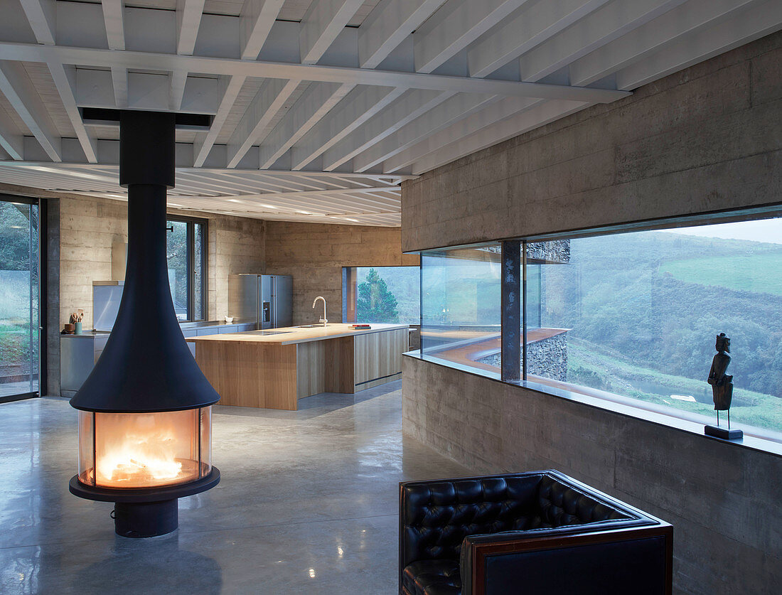 Free-standing fireplace in minimalist, architect-designed house