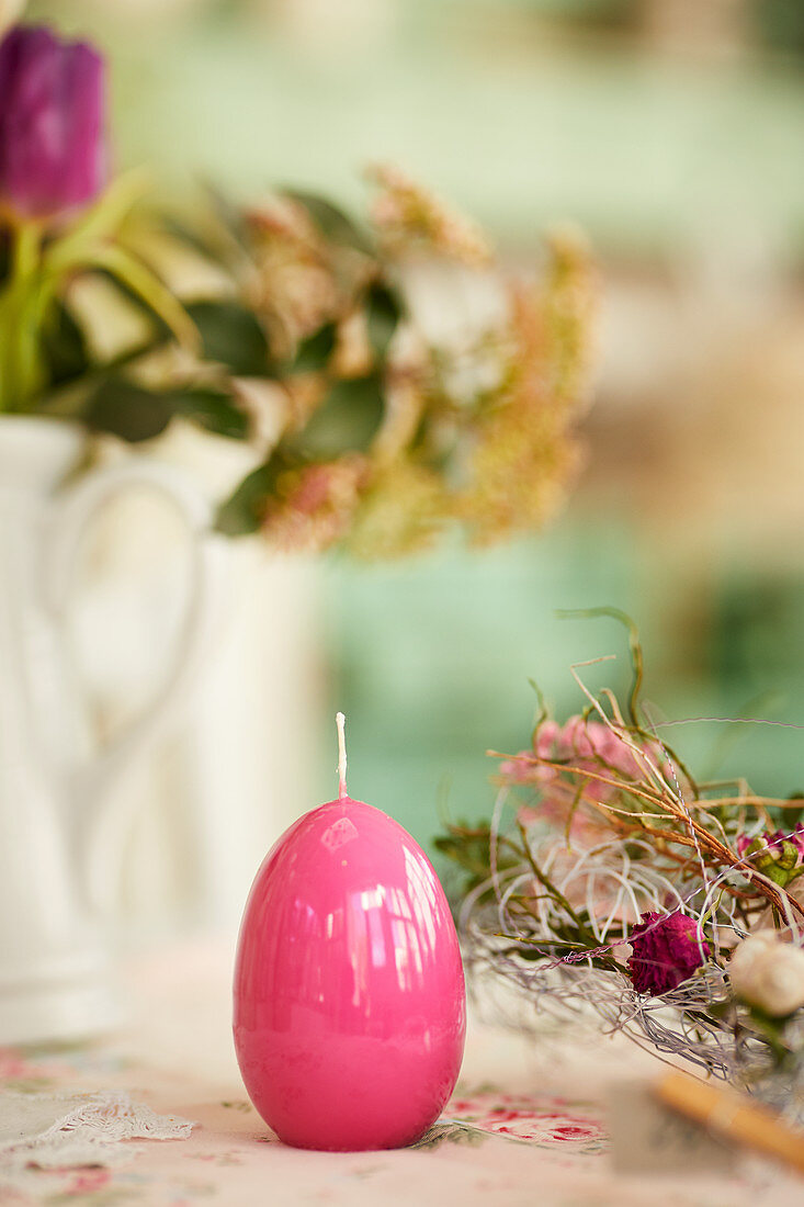 Pink Easter-egg candle decorating table