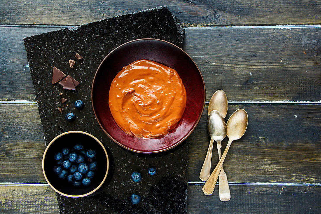 Chocolate banana smoothie bowl with fresh blueberry