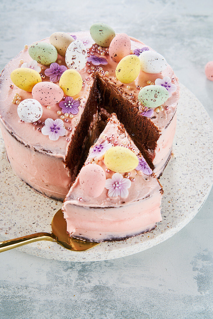 Easter cake with chocolate eggs, sliced