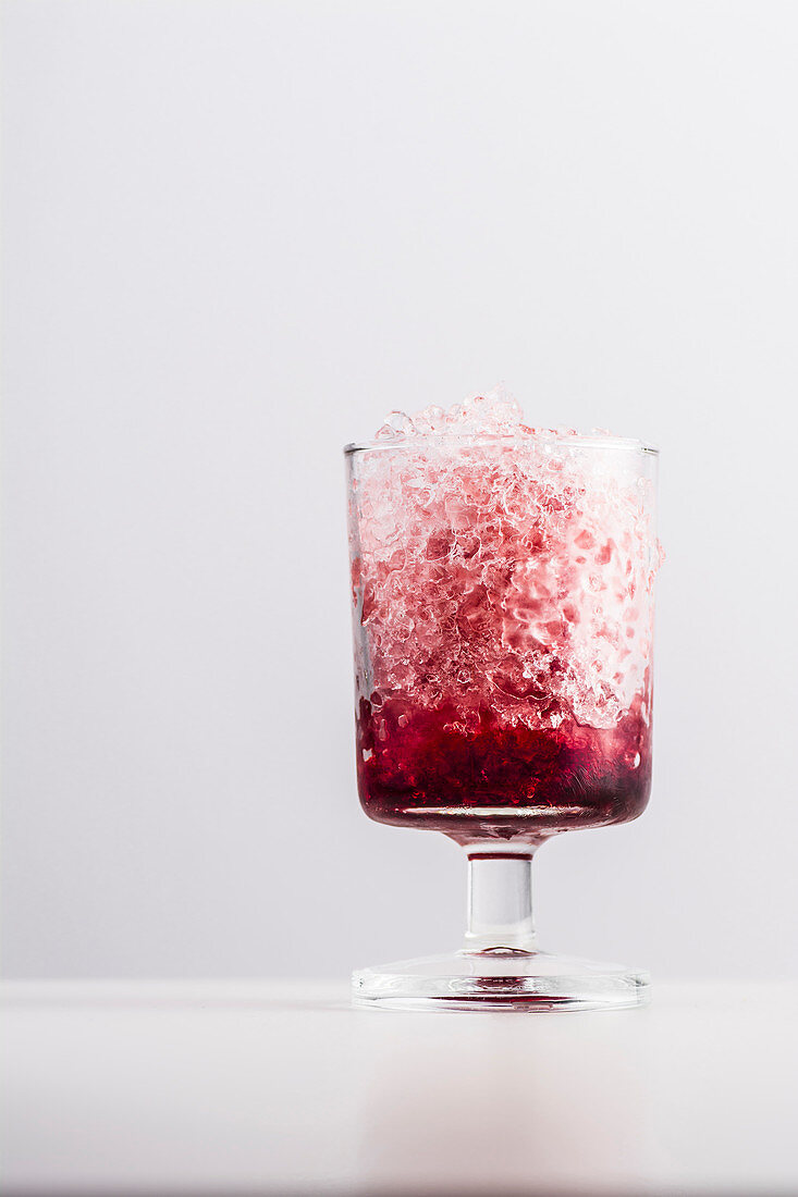 Crushed ice with pomegranate syrup