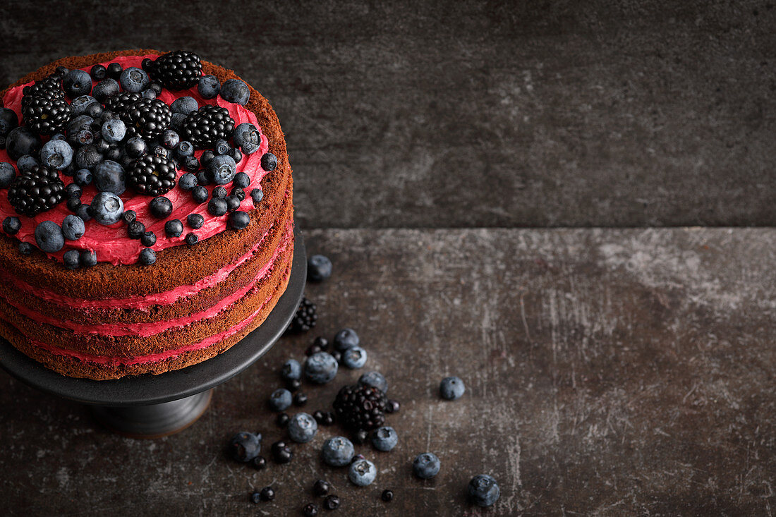 A naked cake with blueberries