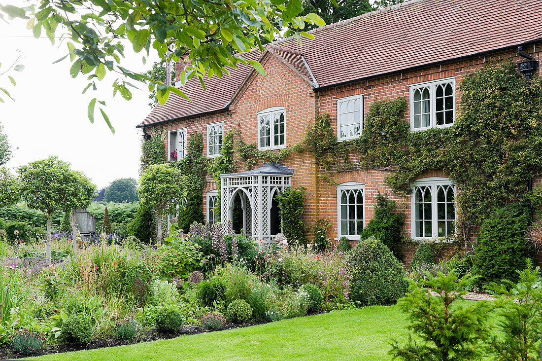 Renovated English country house with Gothic lattice windows