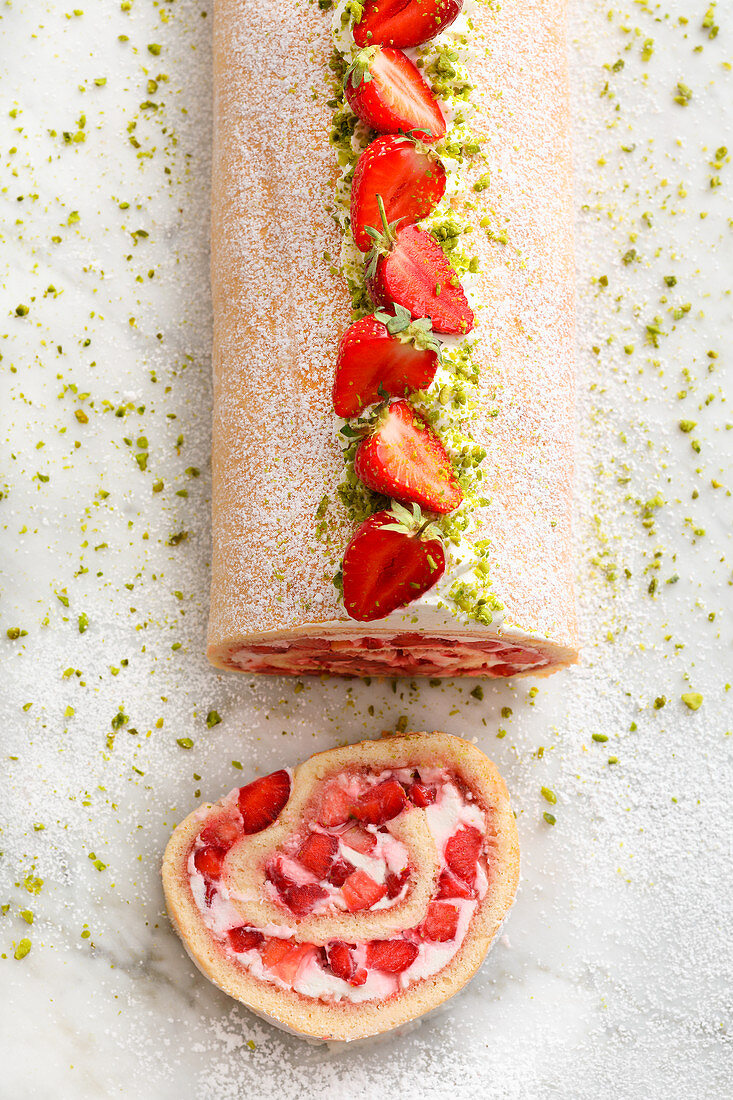 Strawberry and cream Swiss roll with pistachios