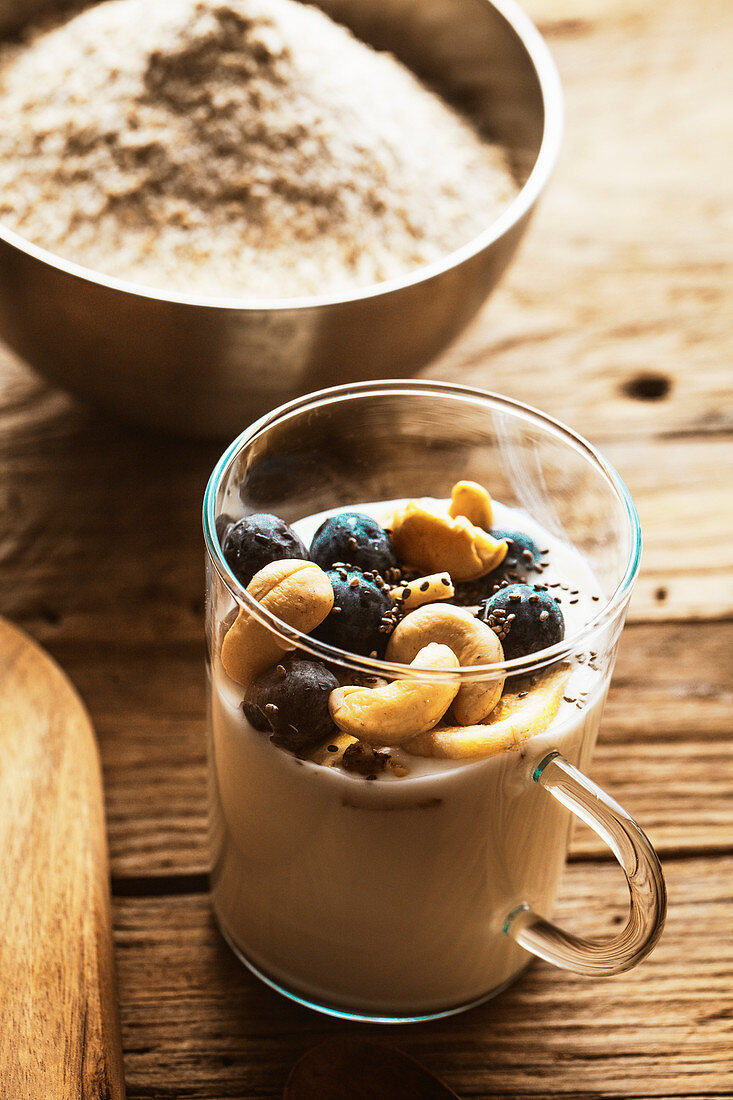 Healthy breakfast yogurt with seeds, grapes and cashews