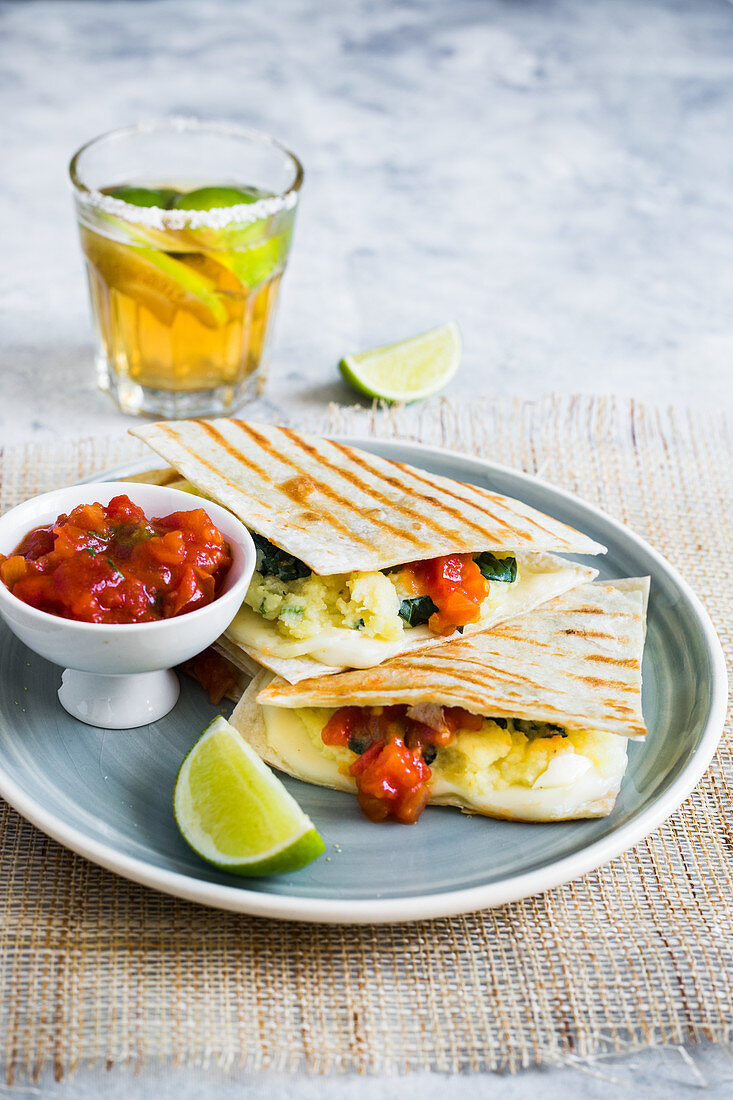 Quesadillas with potato and spinach filling and tomato salsa
