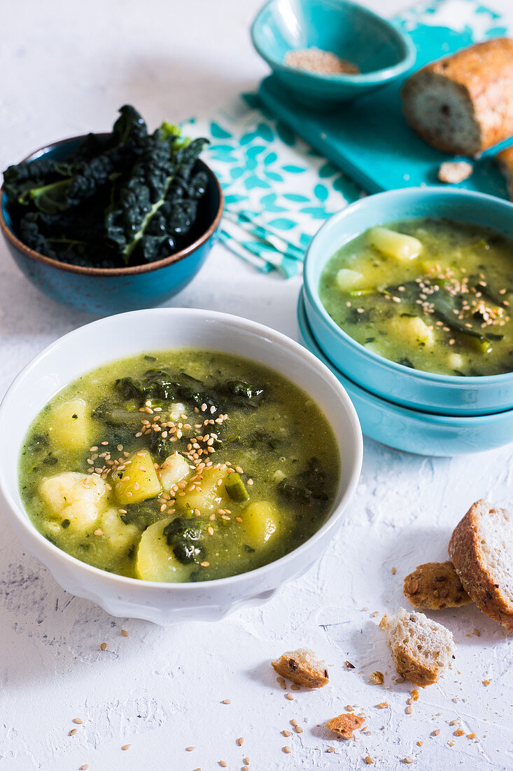 Kale, cauliflower and pototoe soup garnished with sesame seed