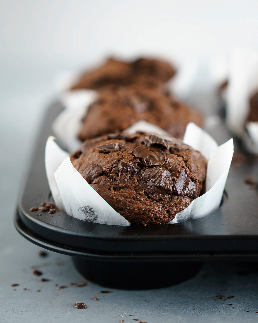 Chocolate muffins in white muffin cases