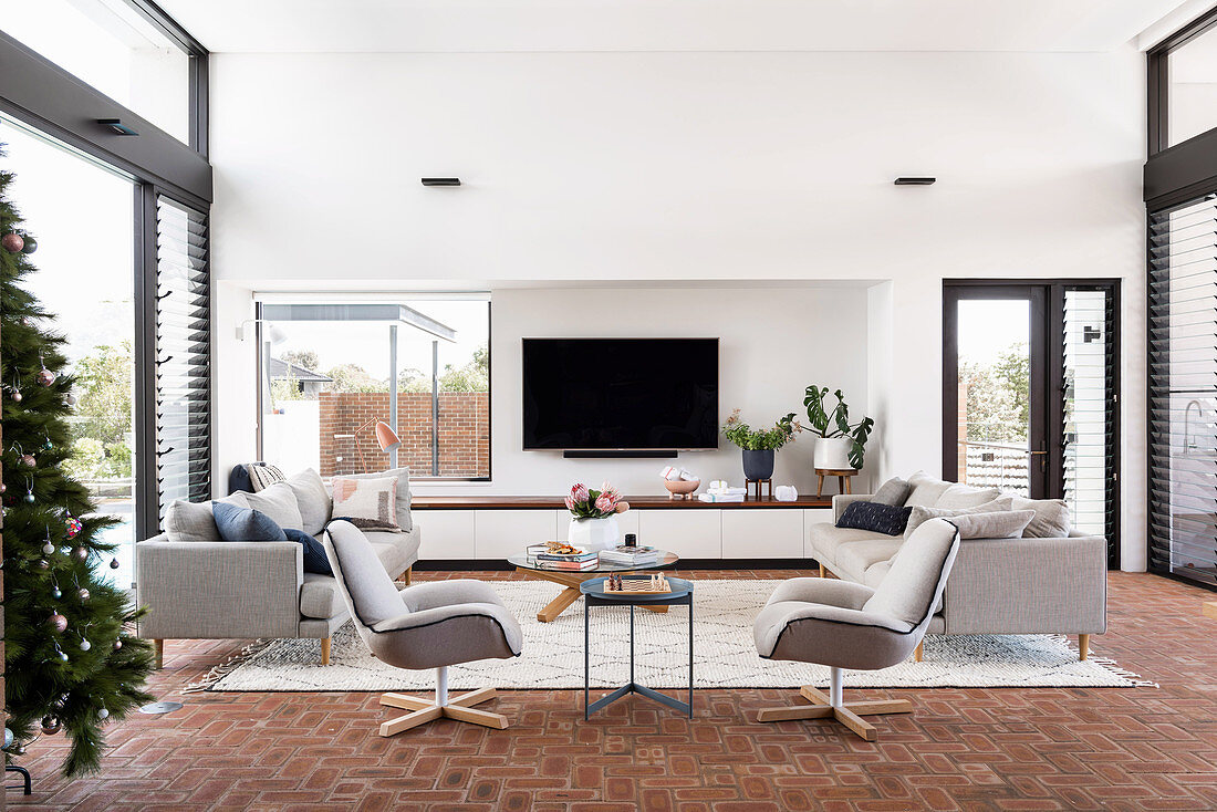 Modern living room with light gray upholstered furniture