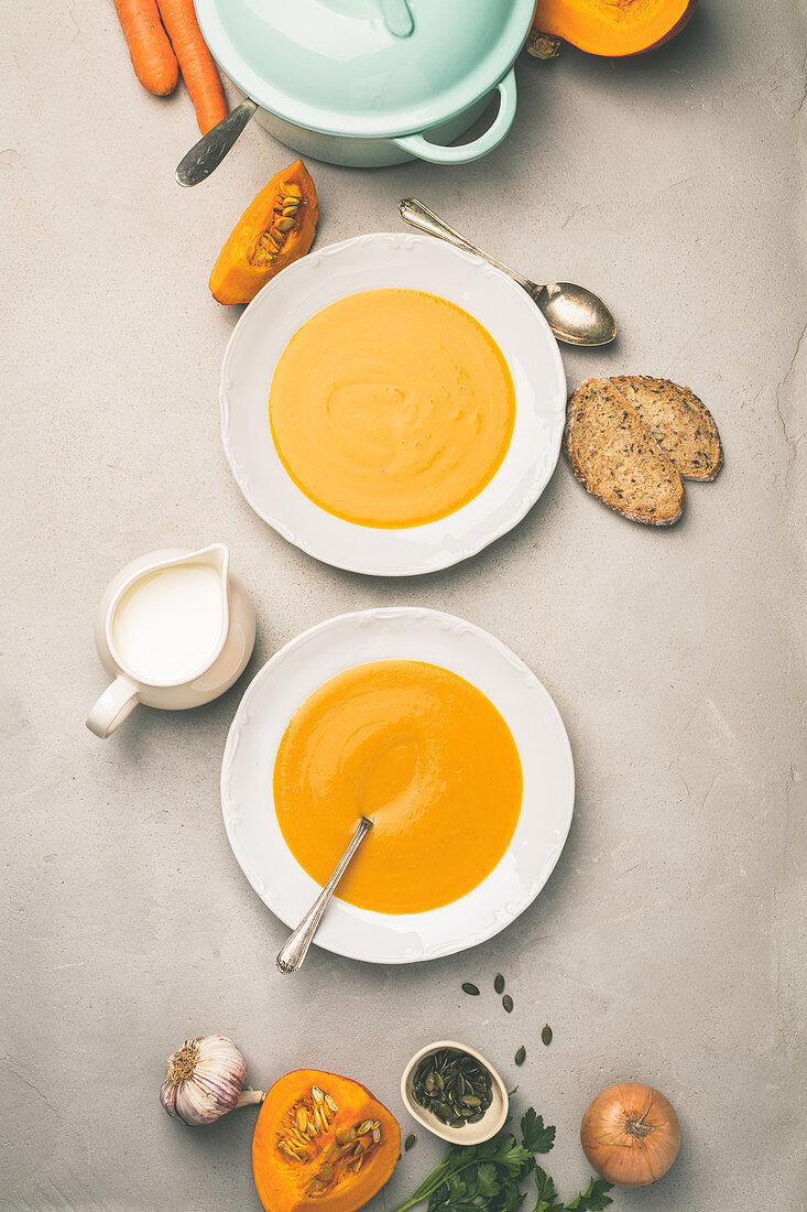 Homemade pumpkin soup and ingredients