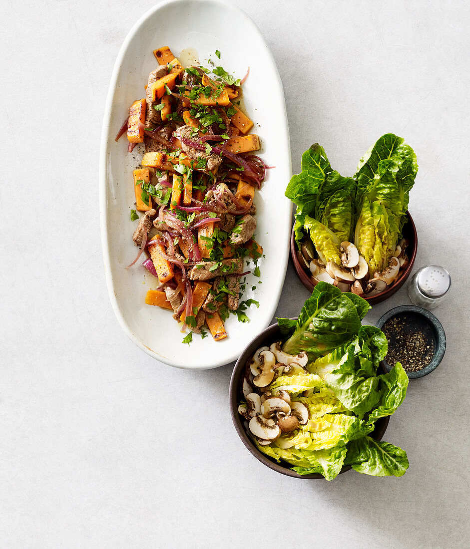 Beef with sweet potatoes and lettuce with pistachios