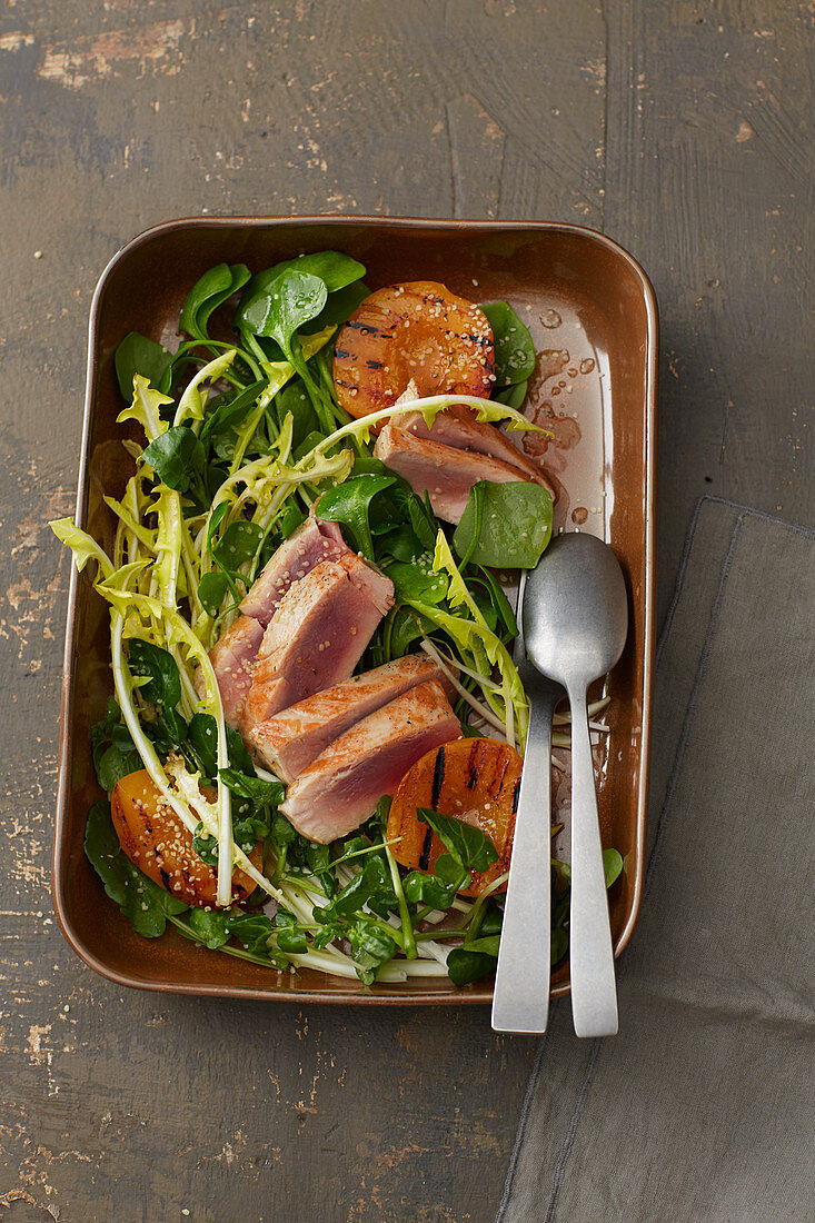 Tuna fish steaks with wild herbs and peaches