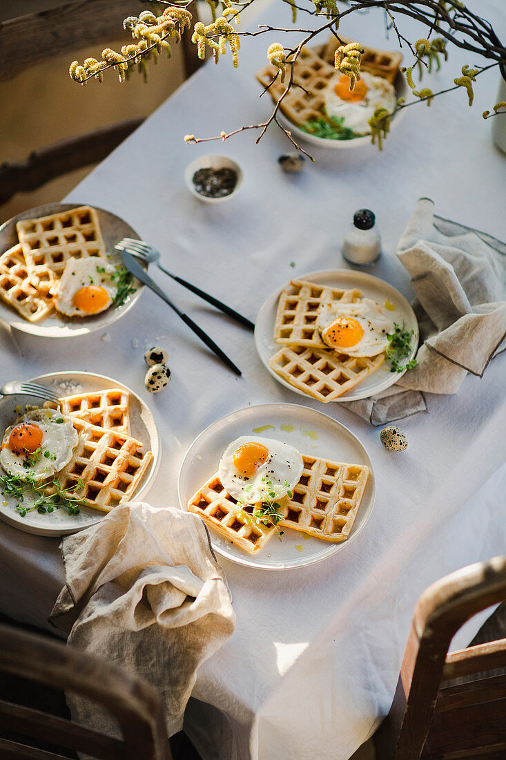 Waffles with fried quail eggs