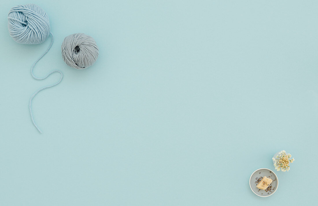 Knitting yarn on a blue surface