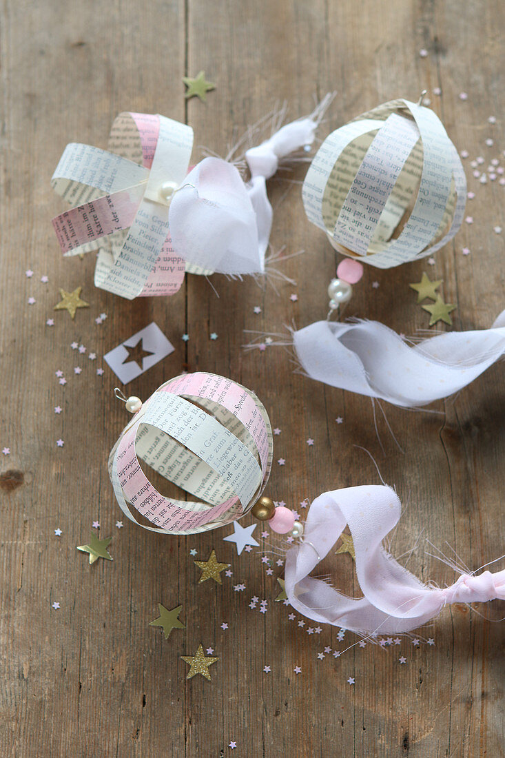 Christmas baubles handcrafted from coloured book pages