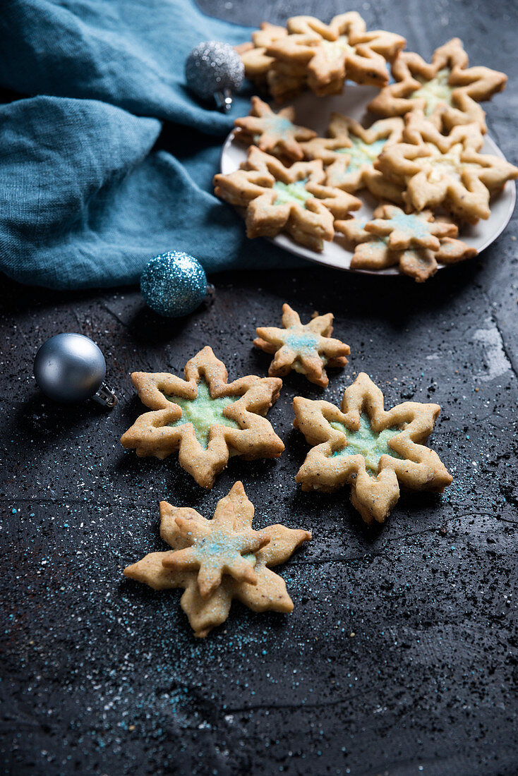 Snowflake shortbread biscuits with vanilla soy cream and blue powdered sugar (vegan)