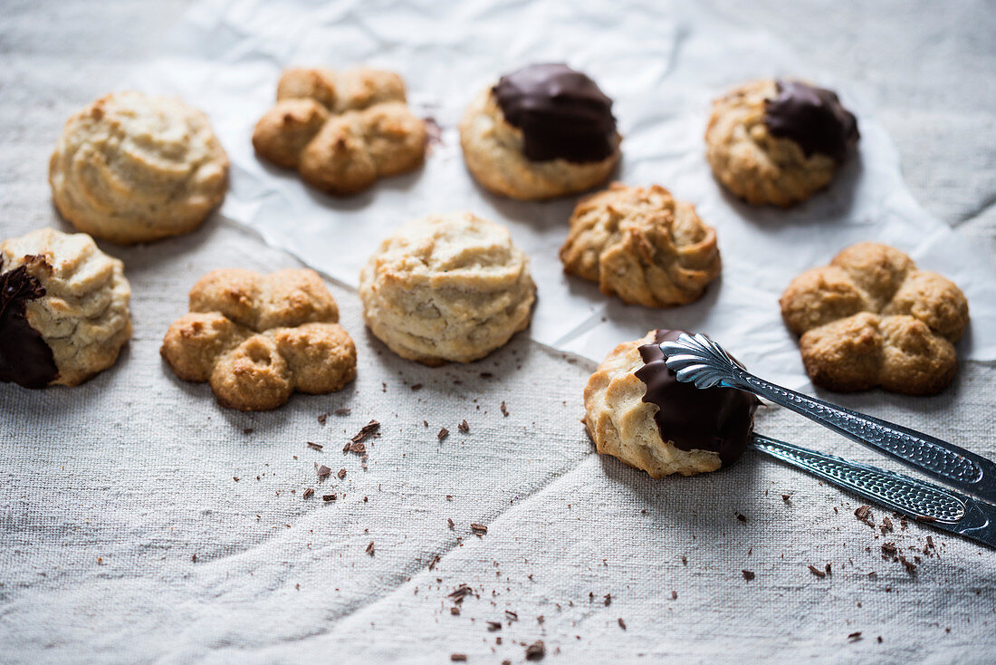 Vegan coconut biscuits, partly dipped with chocolate