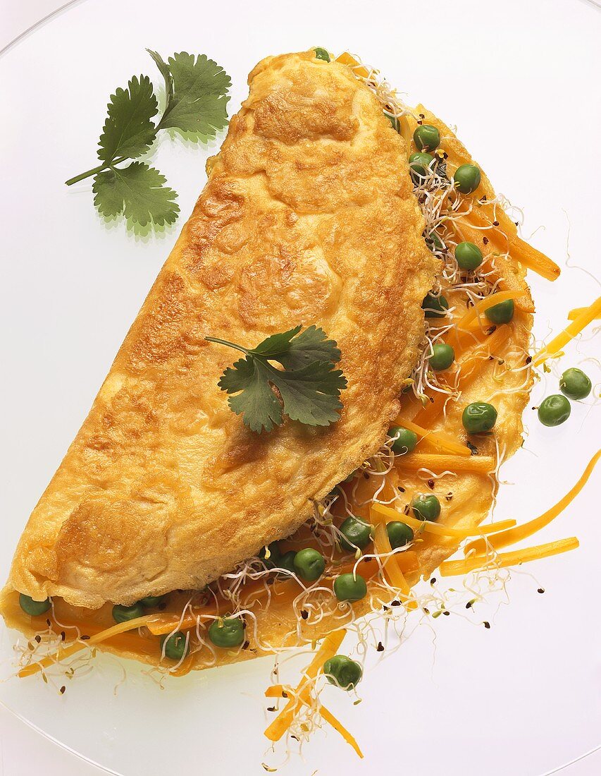 Omelette filled with peas, carrots & cress sprouts