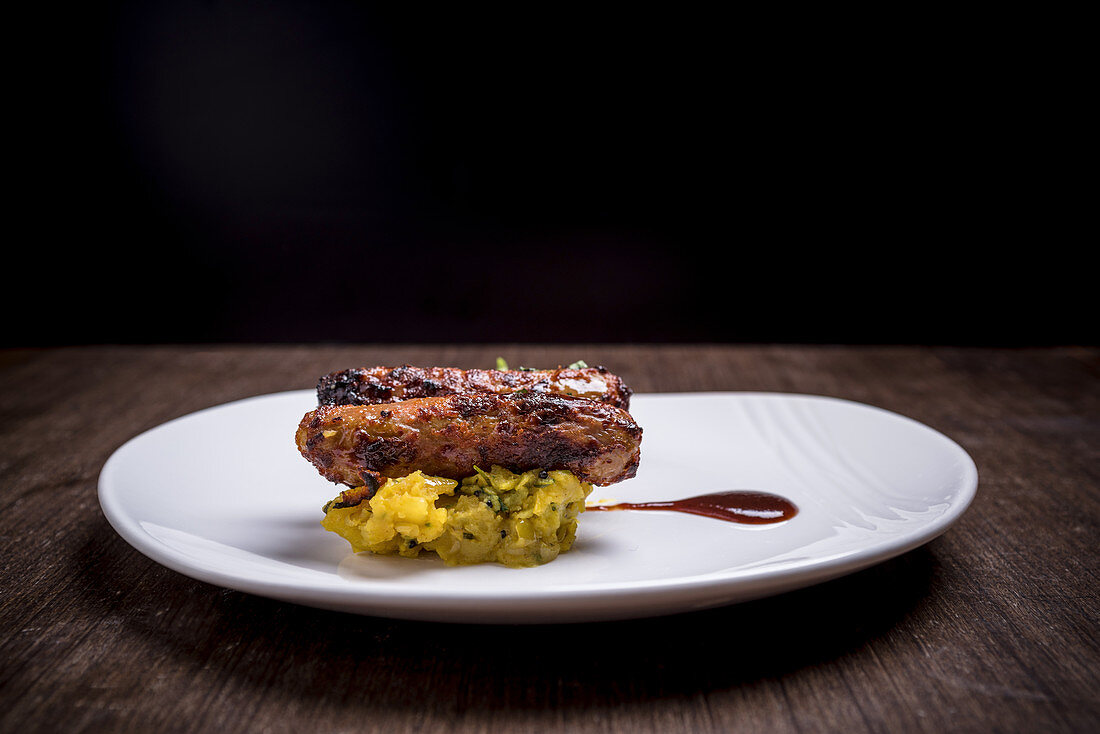 Duck sausages on a serving dish