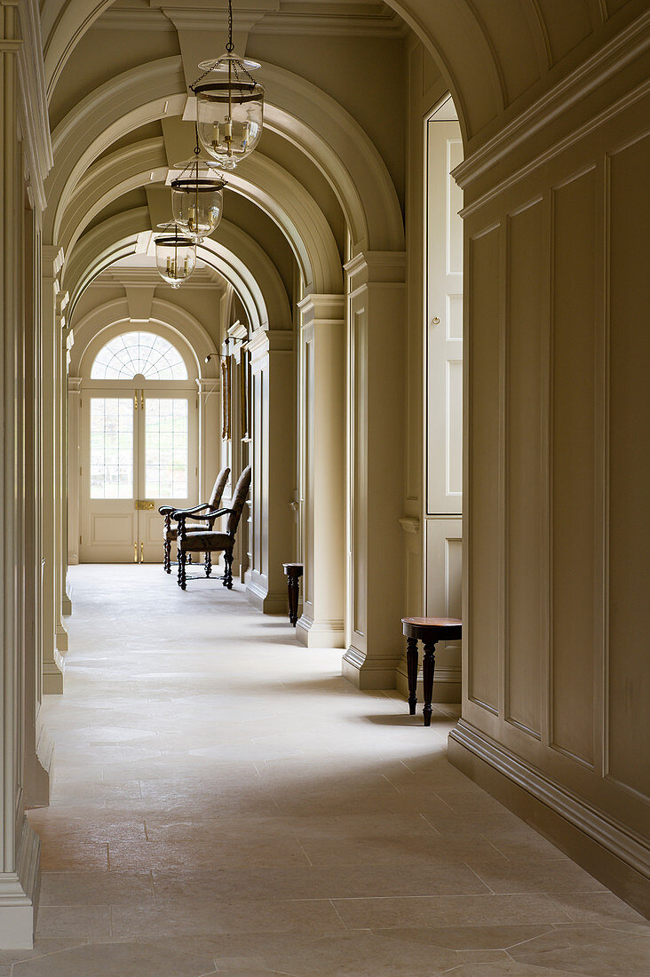 Elegant arched passageway in English manor house