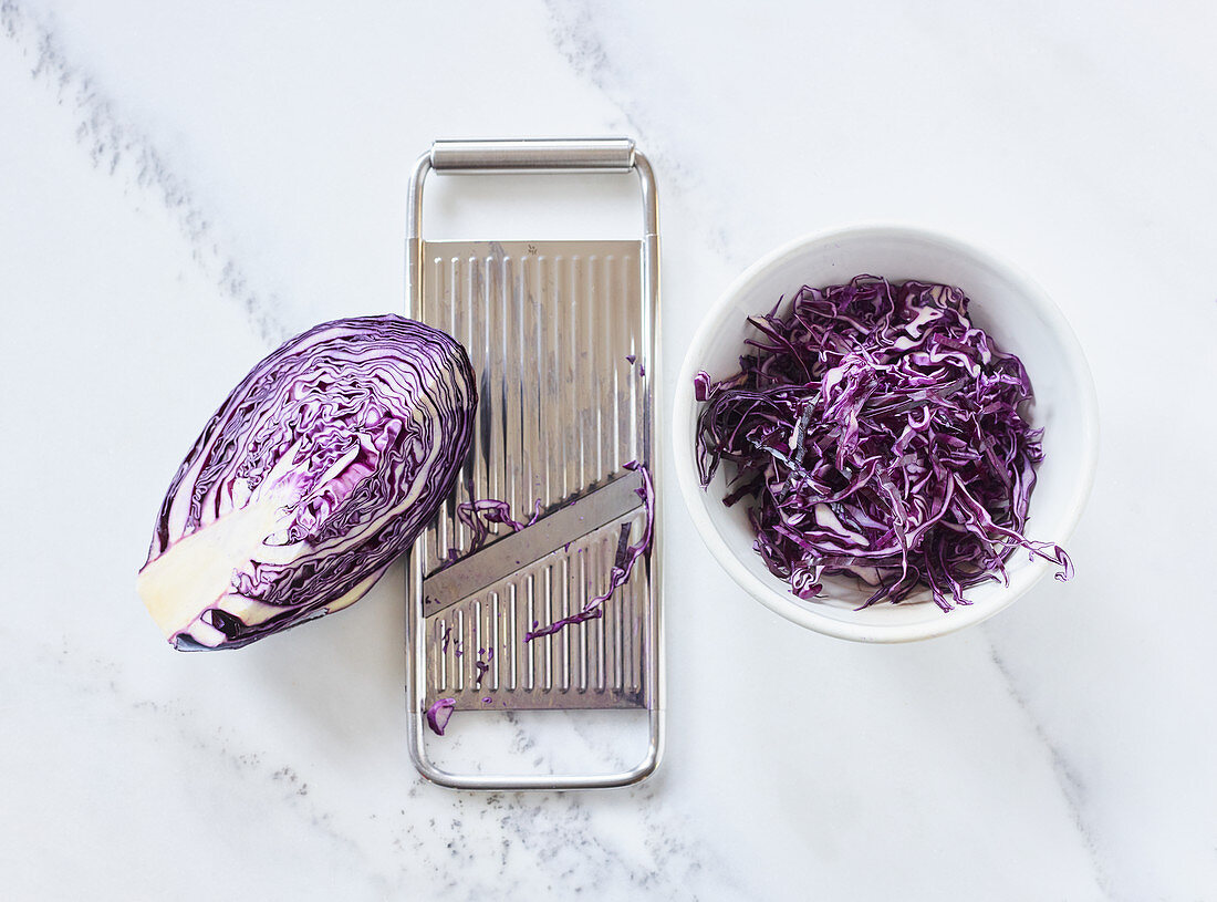Red cabbage being grated