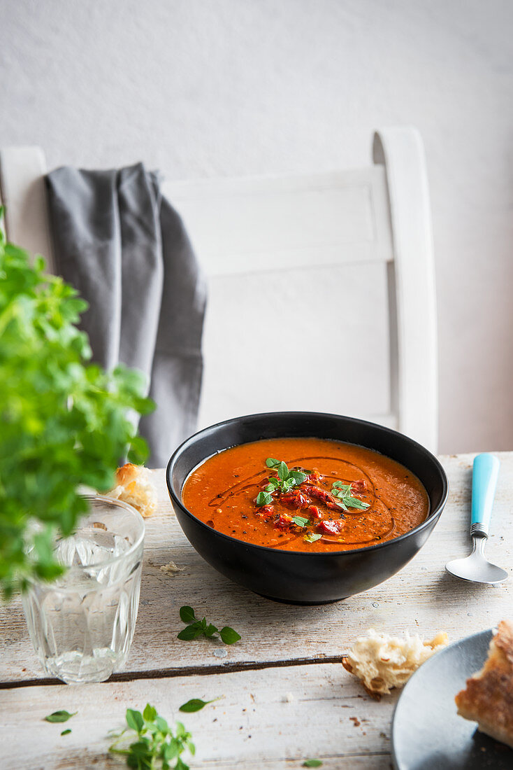 Tomato and roasted pepper soup with chorizo sausage and fresh basil