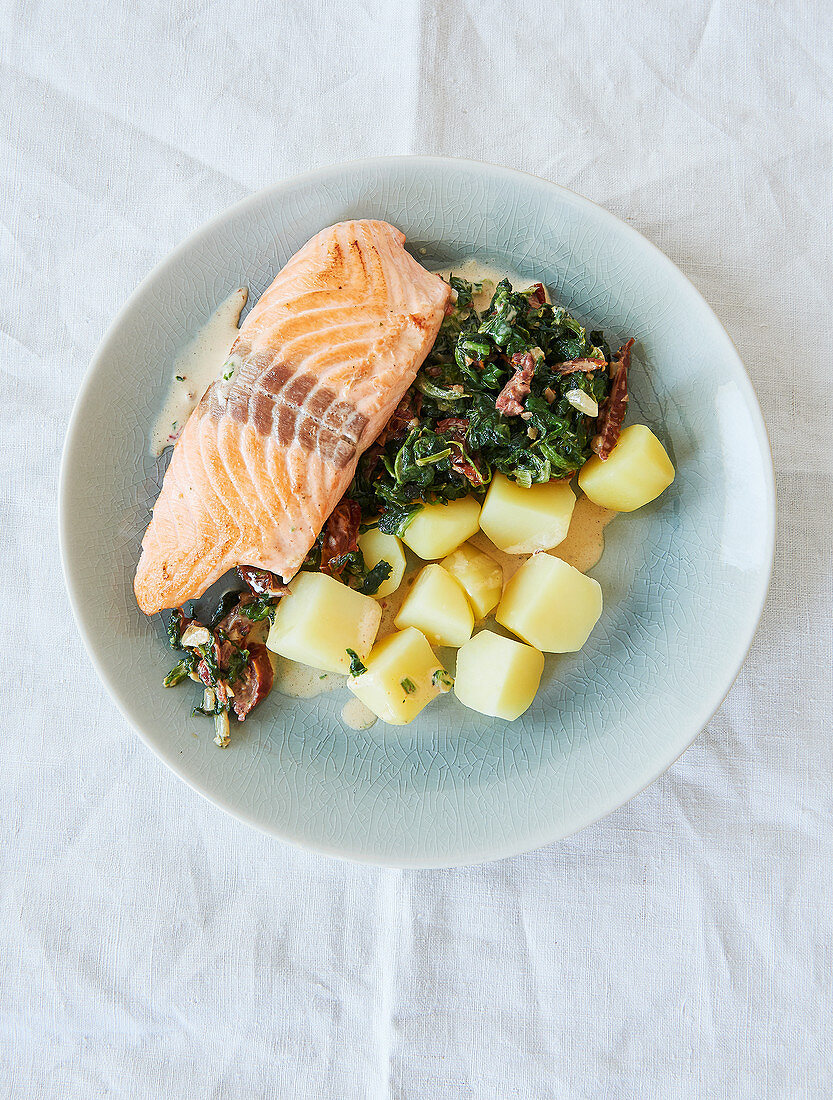 Salmon in a spinach sauce with potatoes