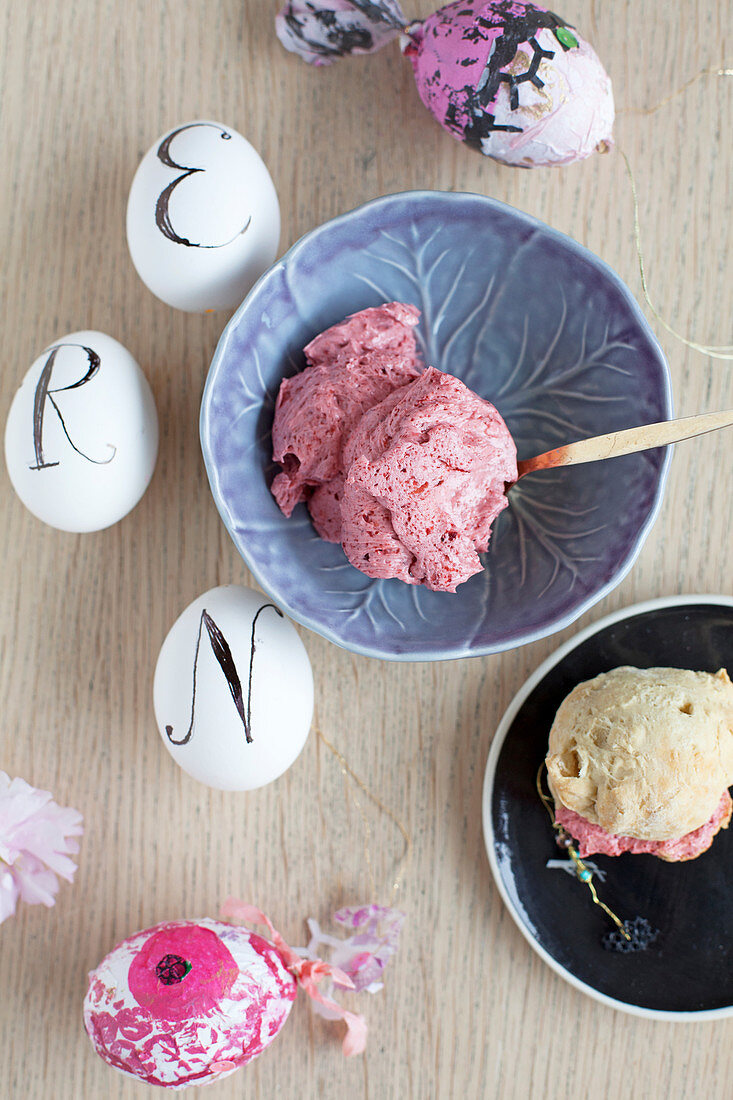 Beetroot butter in small bowls and scones for Easter