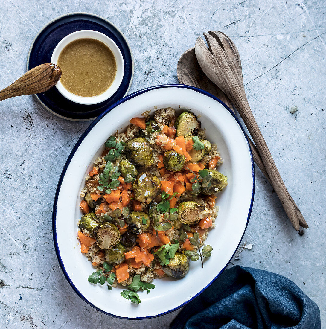 Braised brussels sprouts and pumpkin with quinoa in bowl