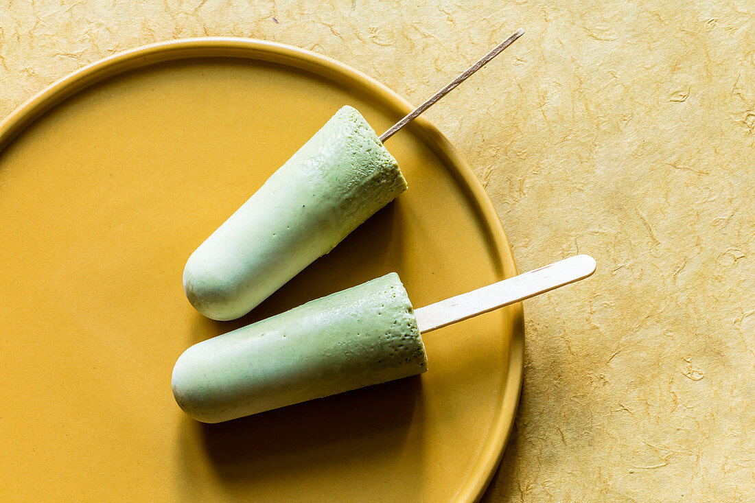 Matcha and mint ice cream sticks made from almond drink
