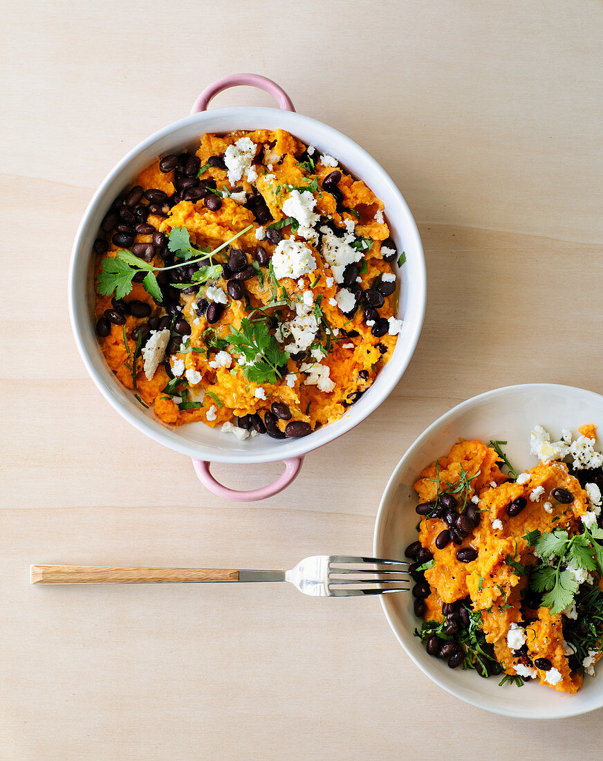 Mashed sweet potatoes with black beans and feta cheese
