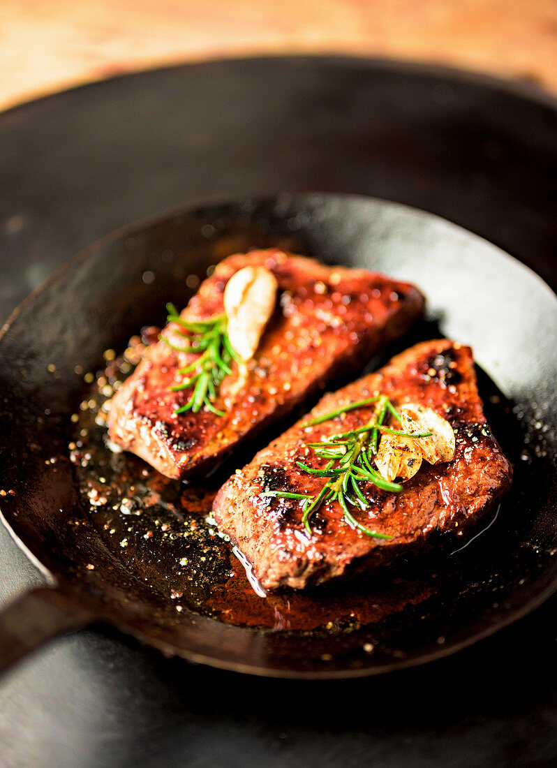 Beef steaks in a pan