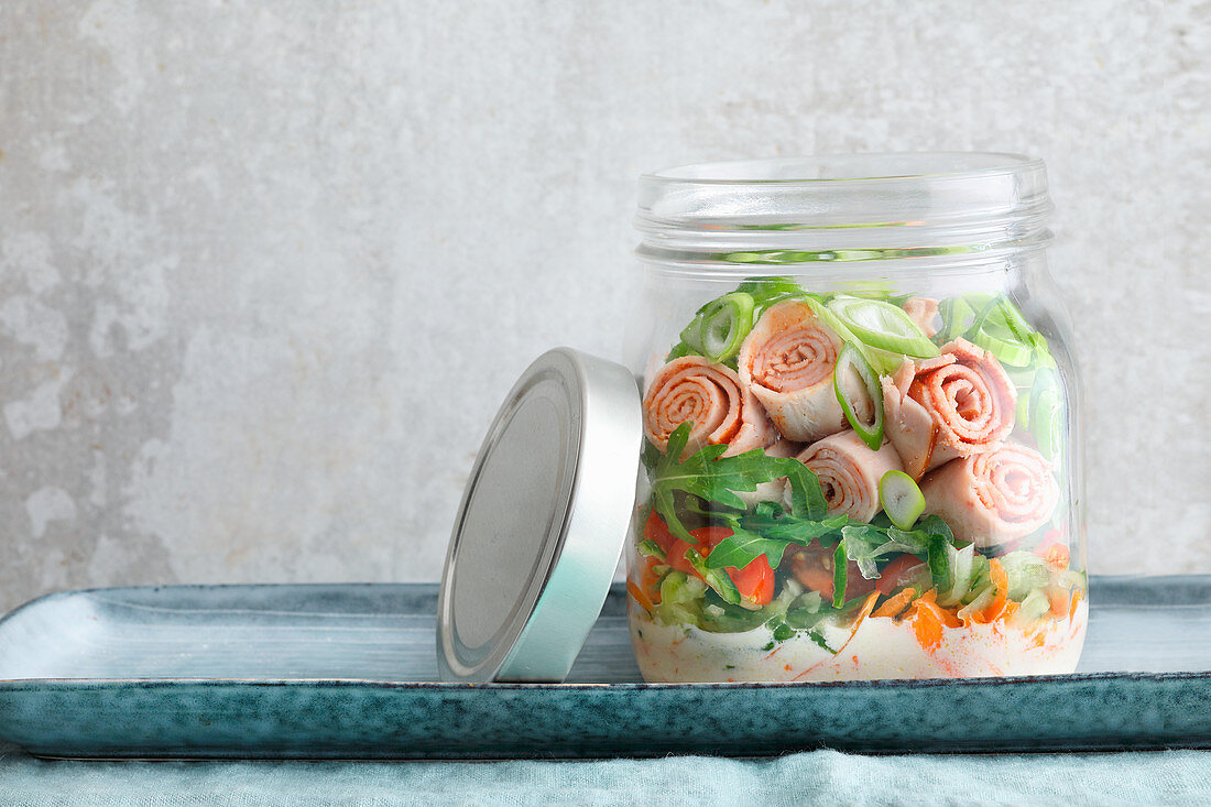 Chicken salad with rocket in a glass
