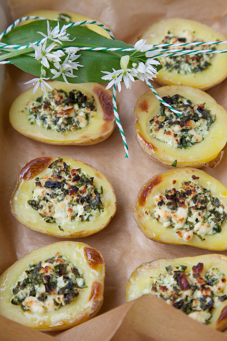 Baked potatoes with wild garlic and sheep's cheese