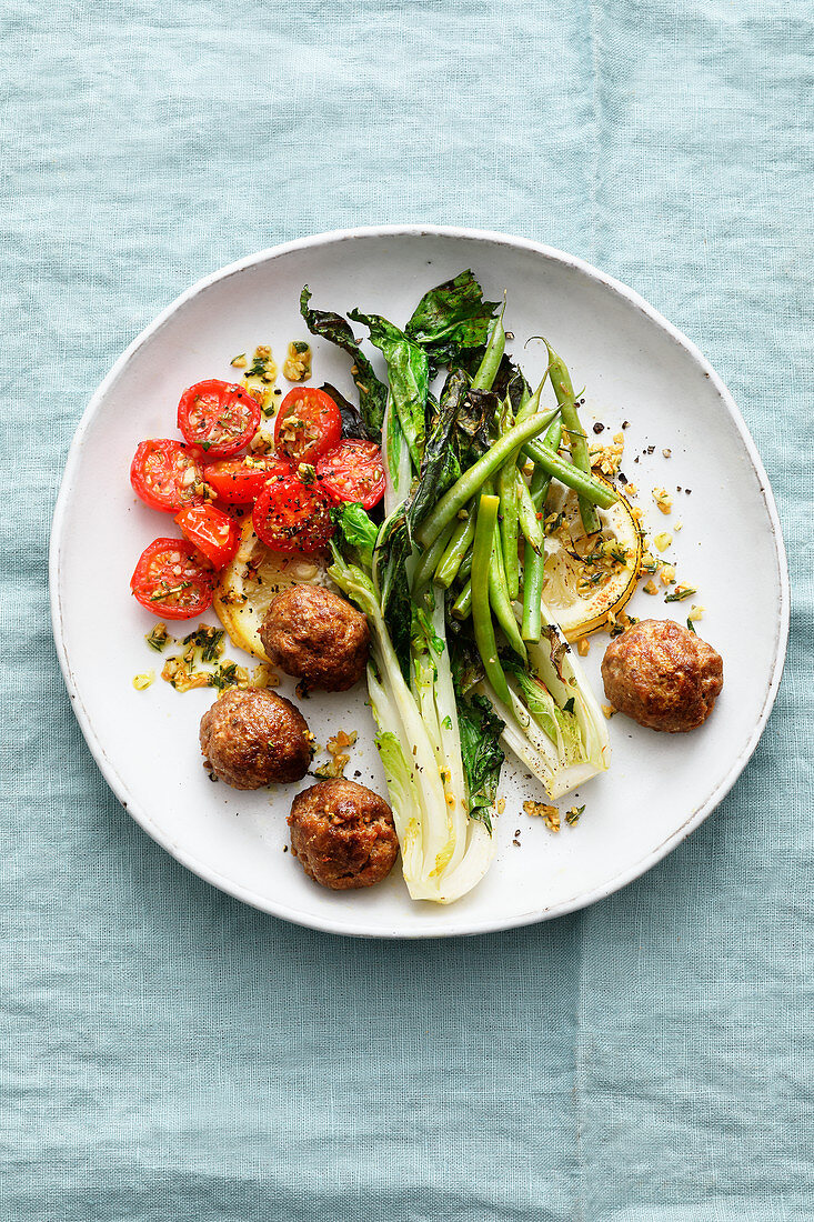 Oven-baked lemon chicken meatballs with bok choy