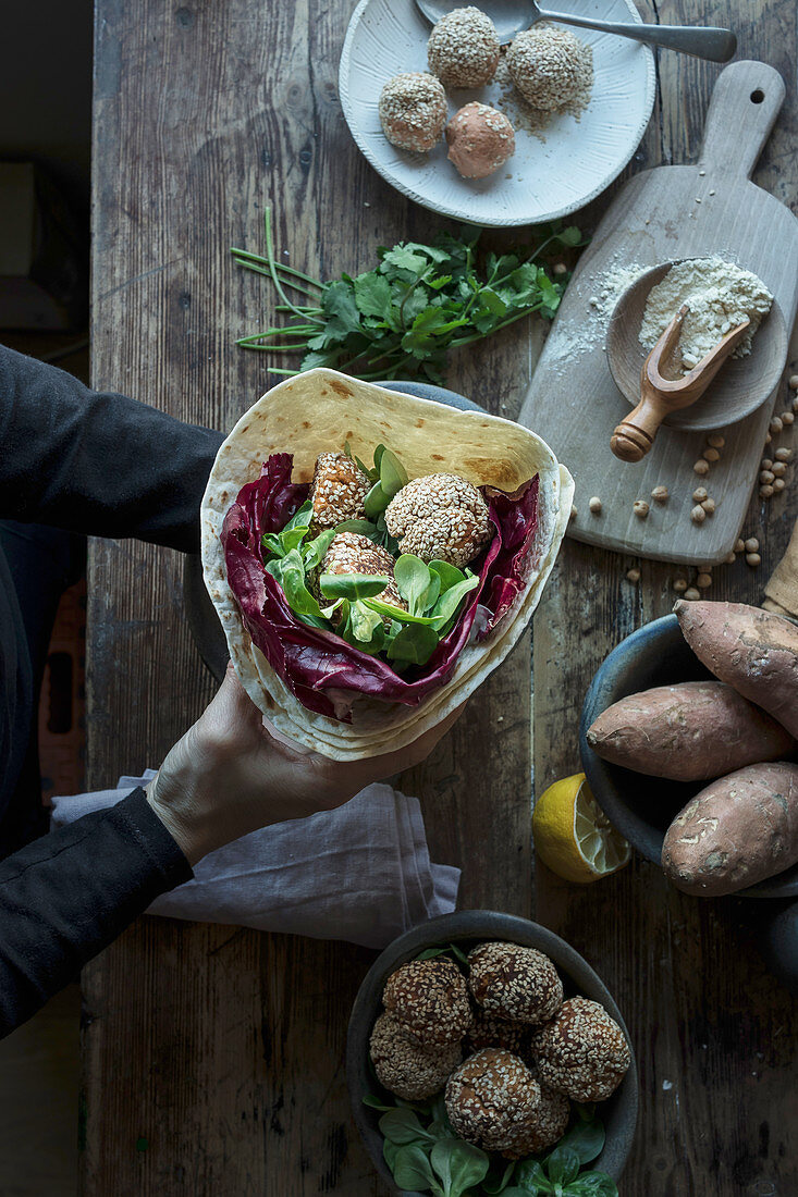 Tasty sweet potato falafel with parsley and cabbage on plate