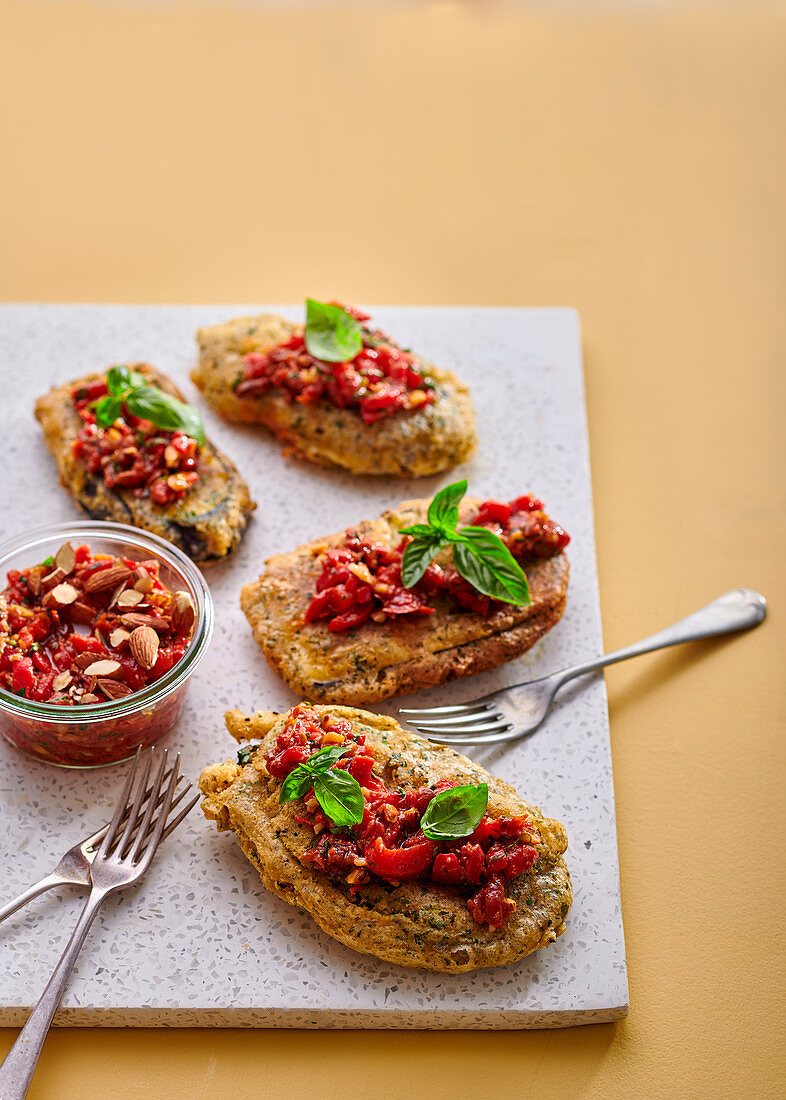 Herb-crusted aubergine steaks with chunky romesco salsa