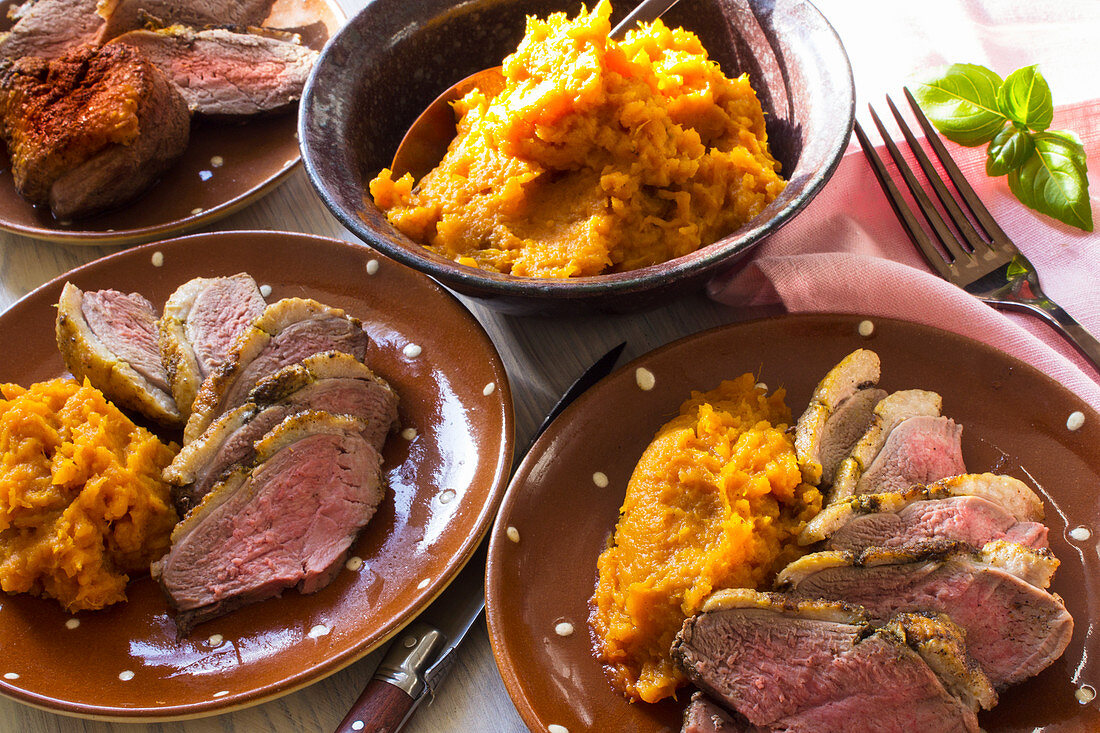 Rare roasted duck breast with mashed sweet potatoes