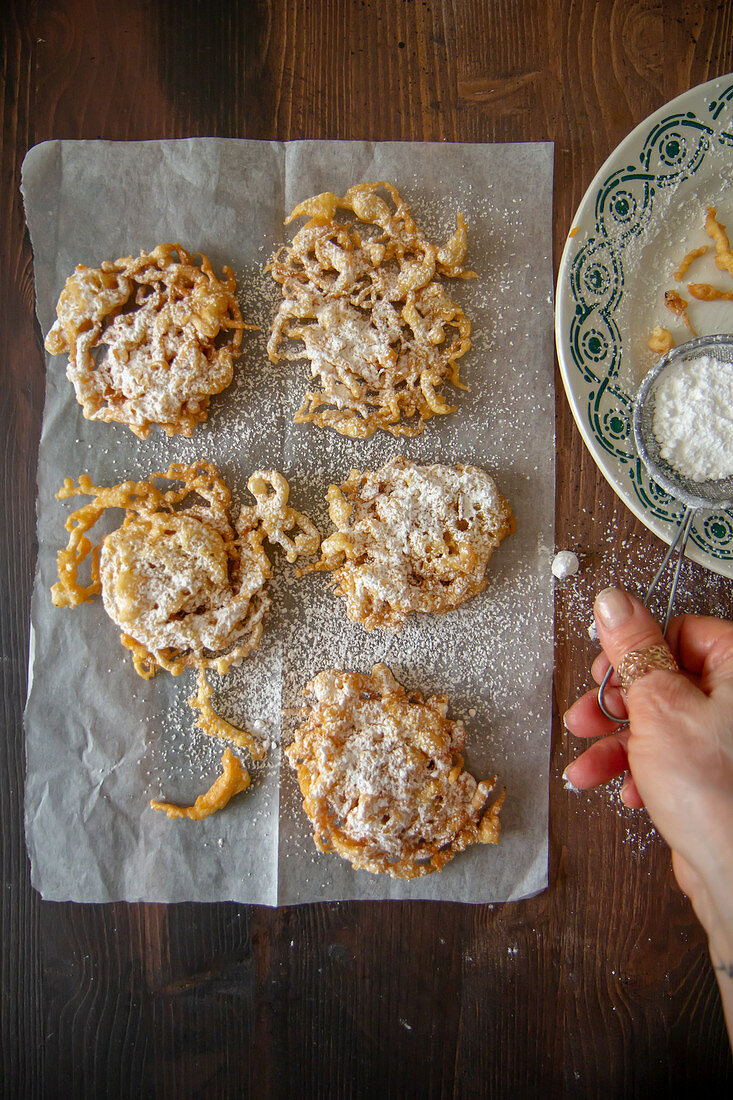 Deep-fried vanilla biscuits with powdered sugar