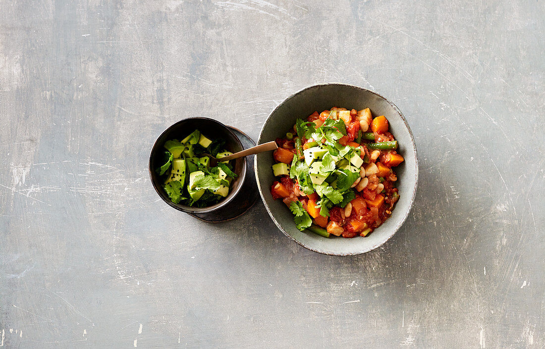 Bean chilli with an avocado and coriander topping