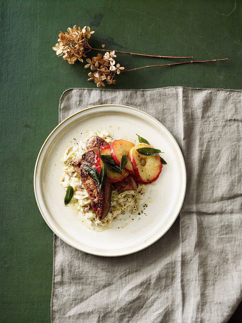 Veal liver on a bed of pointed cabbage with mustard