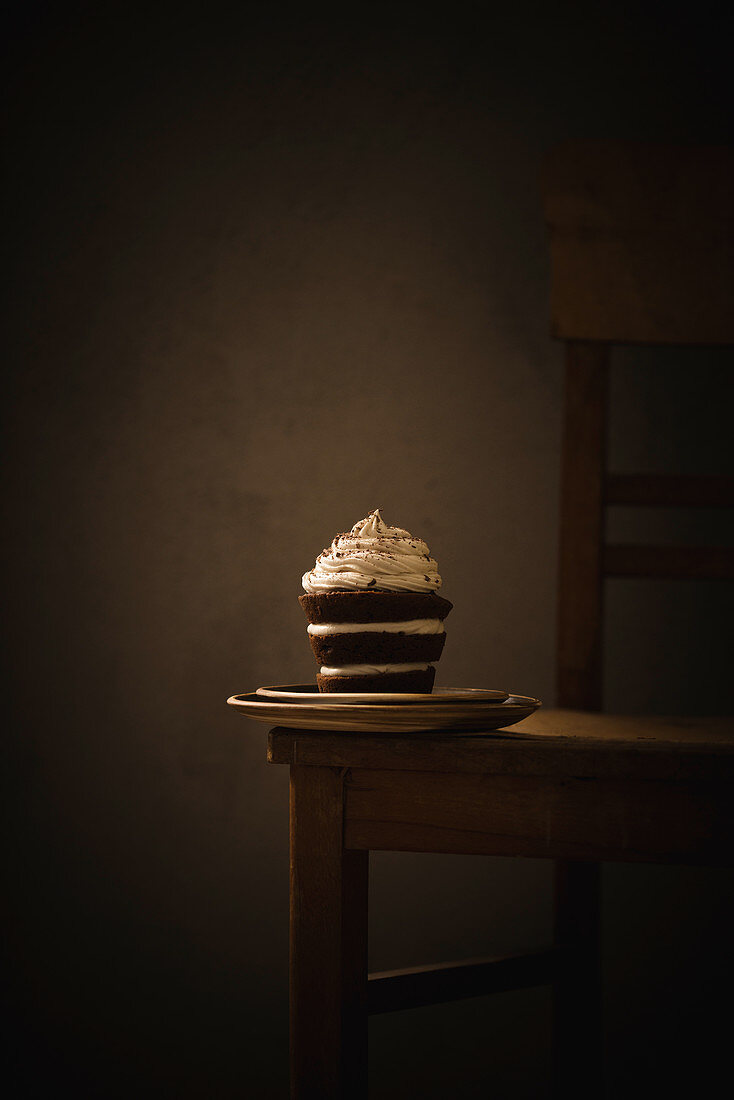 A vegan chocolate creme tart on a wooden chair