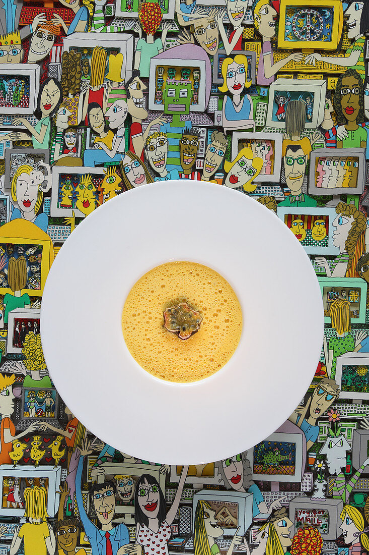 Yellow carrot and passion fruit soup