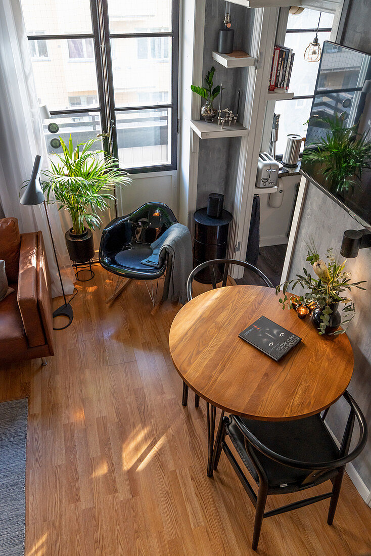 Two chairs at round table in grey, masculine living room