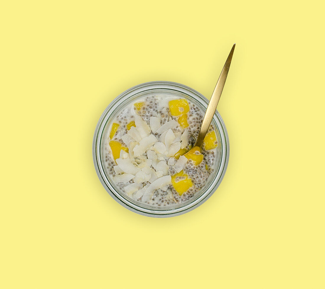 Chia pudding with mango and coconut flakes