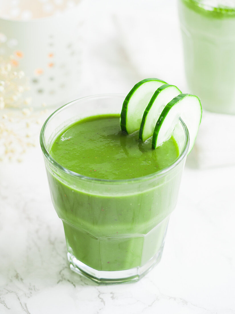 Green smoothie with cucumber slices