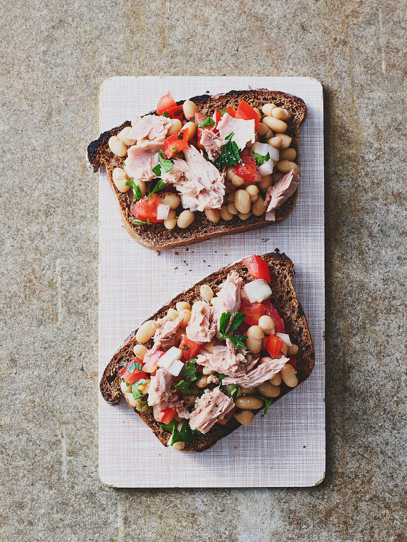 Tuna fish salad with white beans on toasted dark bread