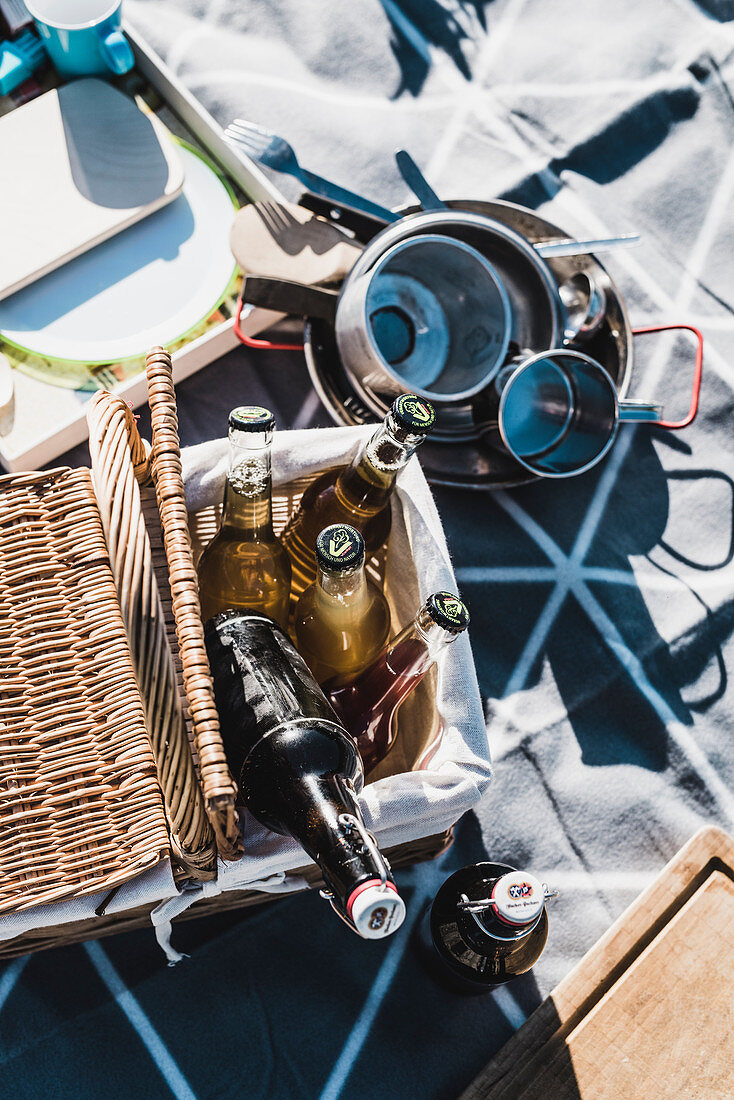 Various bottles in a picnic basket